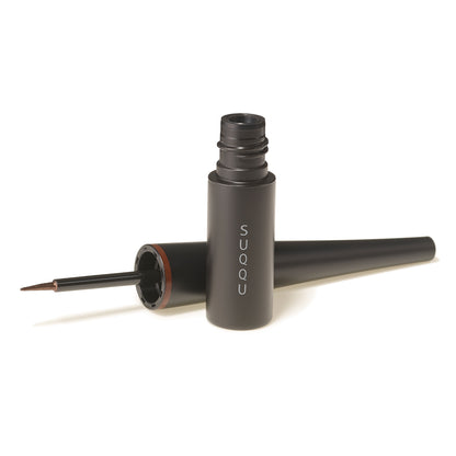 SUQQU Color Ink Liquid Eyeliner make up product with cap open and felt tip on a plain background.