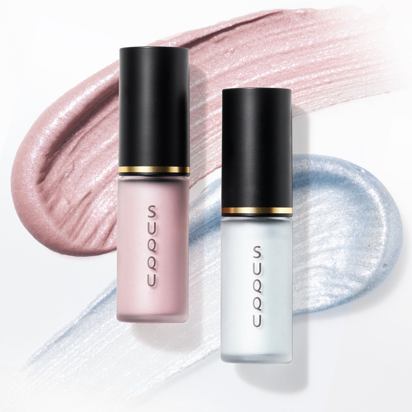 SUQQU Complexion Face Color 06 and 102 liquid highlighter blushers. Displayed on soft shimmering pink and blue pearlescent texture swatch background.