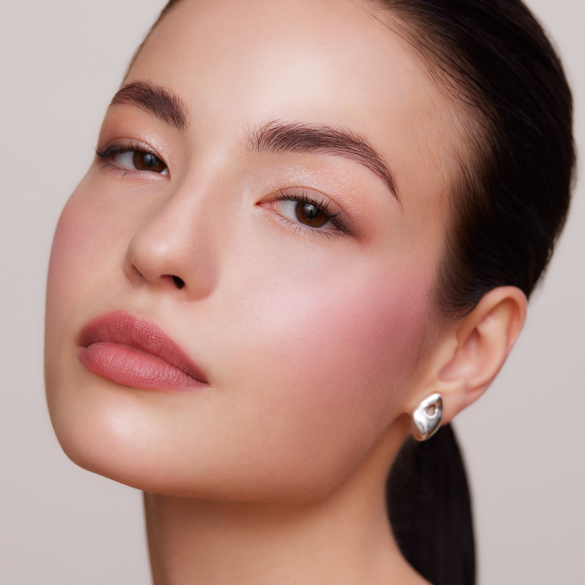 Model portrait wearing SUQQU Complexion Face Color