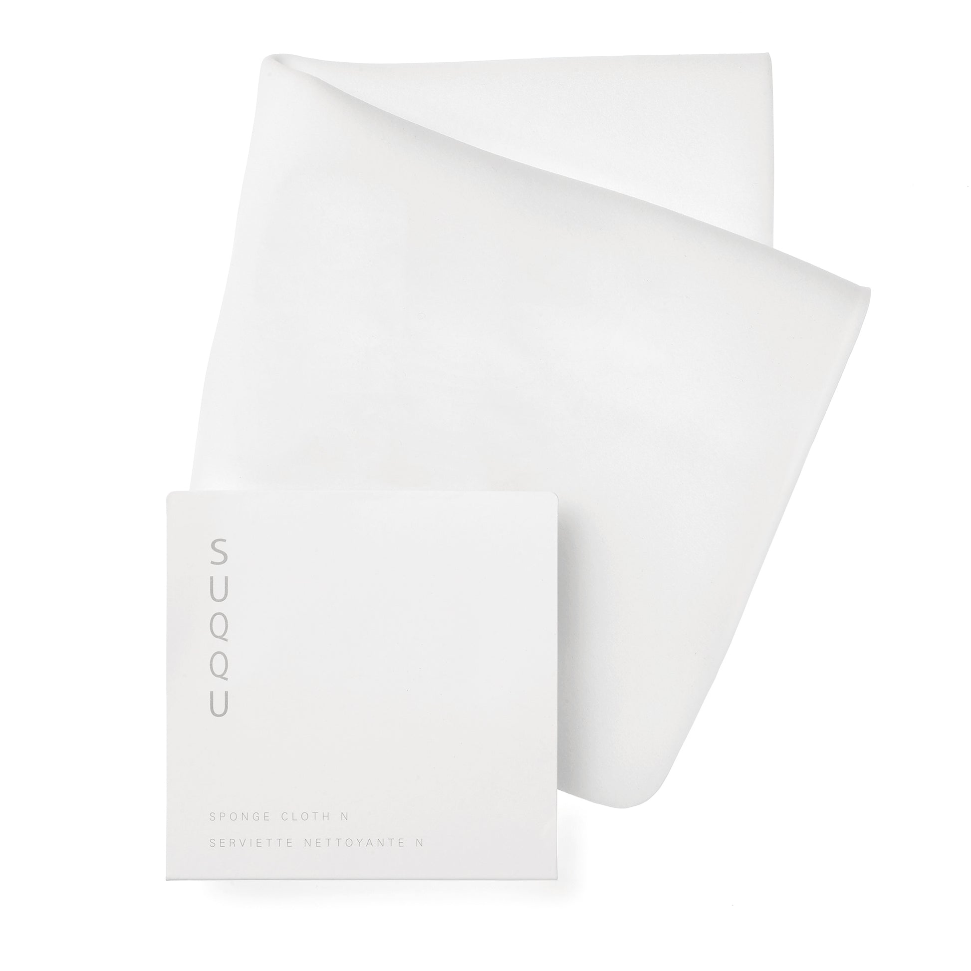 SUQQU Designing Massage Cream Cleansing Cloth with packet on plain background.