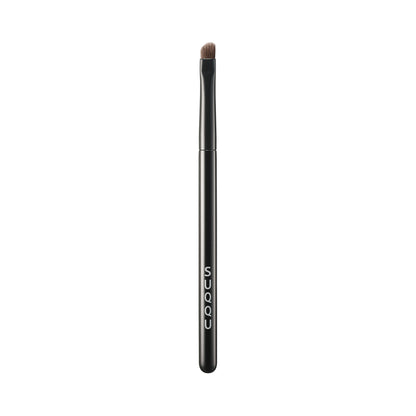 SUQQU Eyeliner Brush N Japanese synthetic artisan professional grade make up brush on plain background.