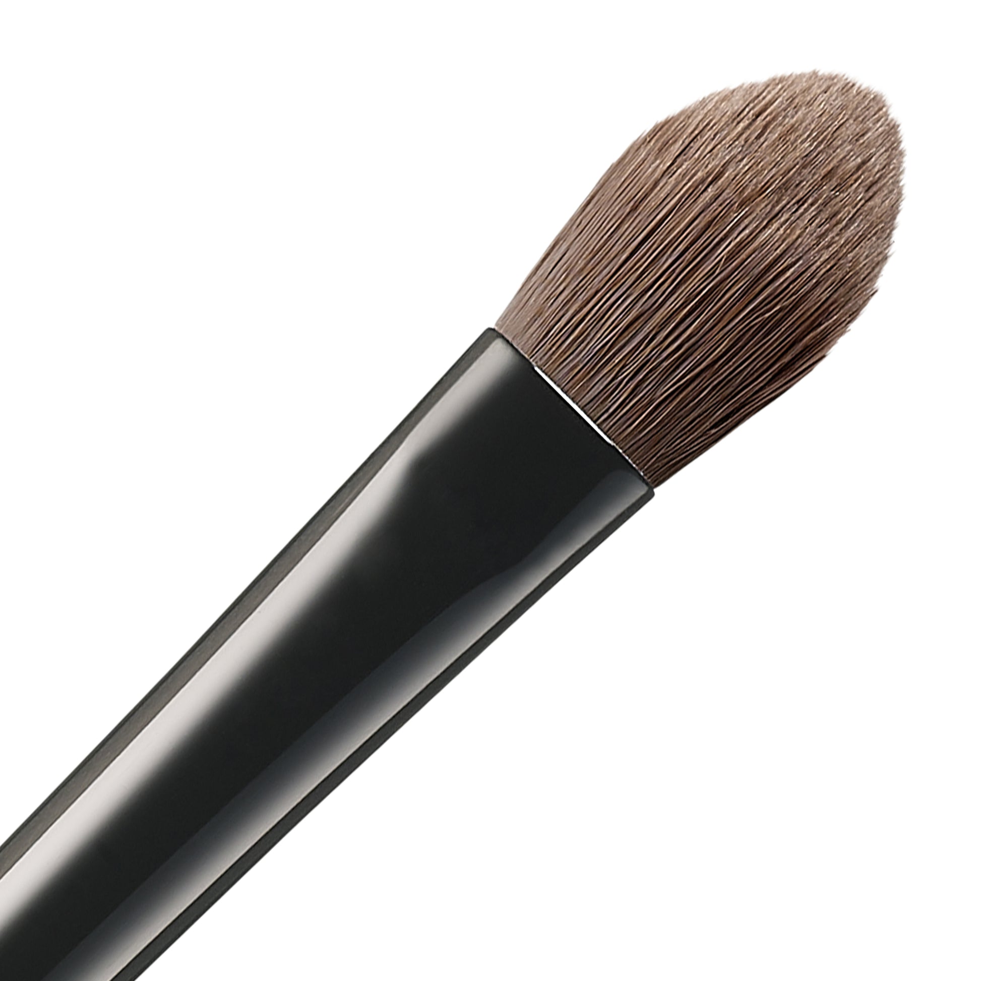 SUQQU Eyeshadow Brush F Large Japanese synthetic artisan professional grade make up brush bristle close up on plain background.