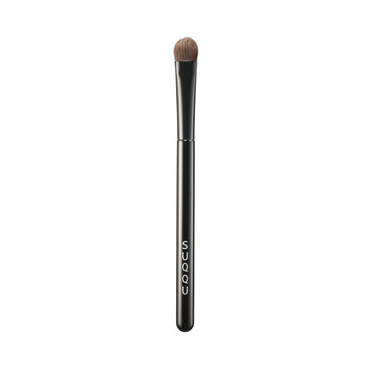 SUQQU Eyeshadow Brush F Small Japanese synthetic artisan professional grade make up brush on plain background.