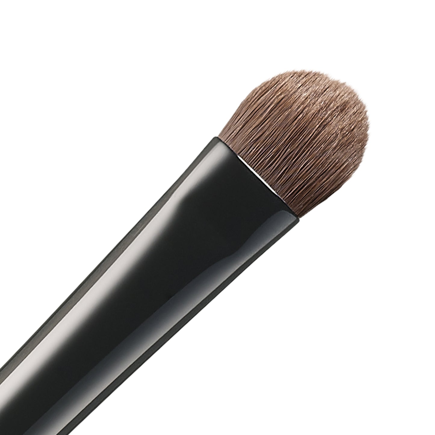 SUQQU Eyeshadow Brush F Small Japanese synthetic artisan professional grade make up brush bristle close up on plain background.