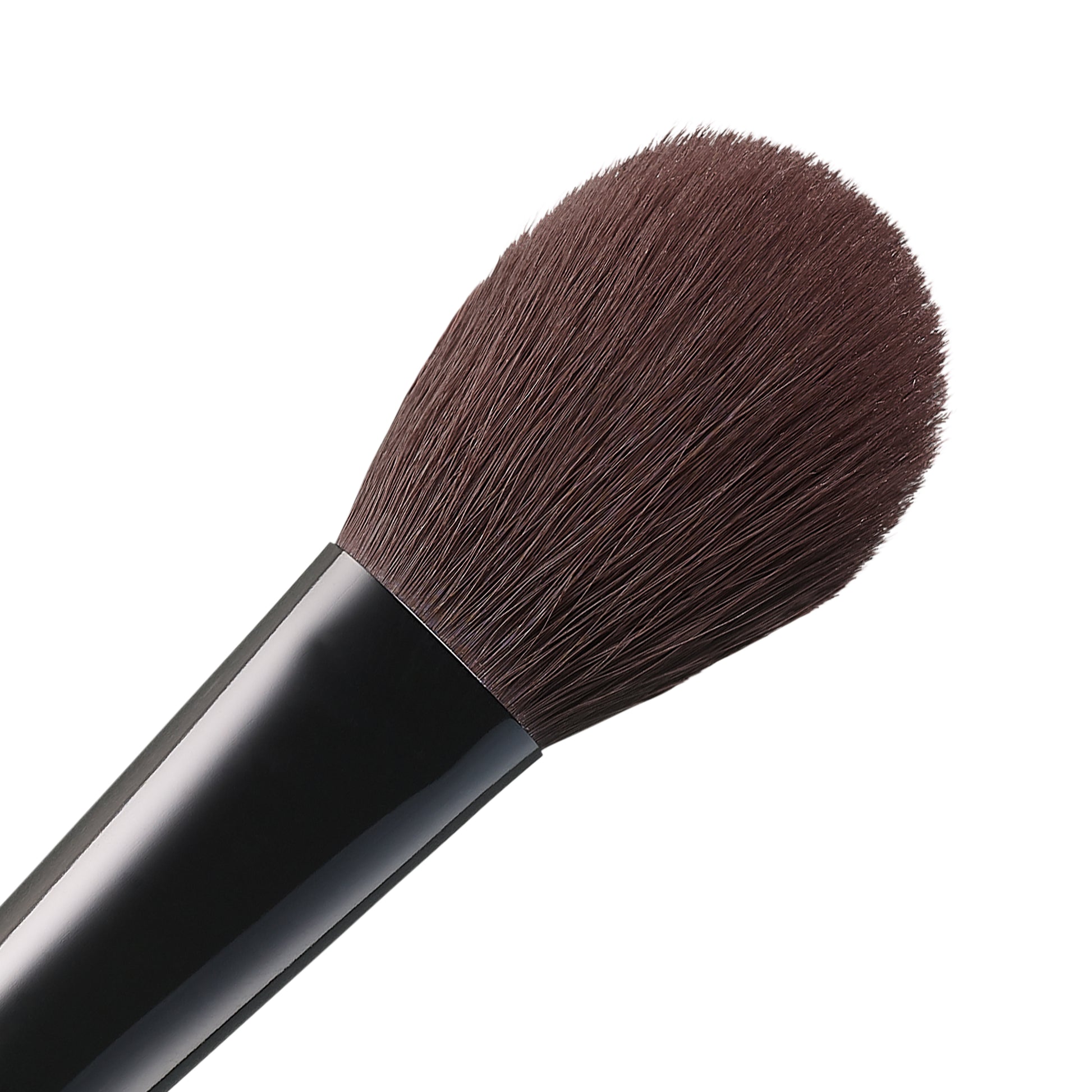 SUQQU Face Color Brush luxury Japanese synthetic artisan professional grade make up brush for blusher and face powder bristle close up on plain background.