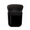SUQQU Foundation Brush Japanese Kabuki style vegan friendly synthetic artisan professional make up brush on plain background.