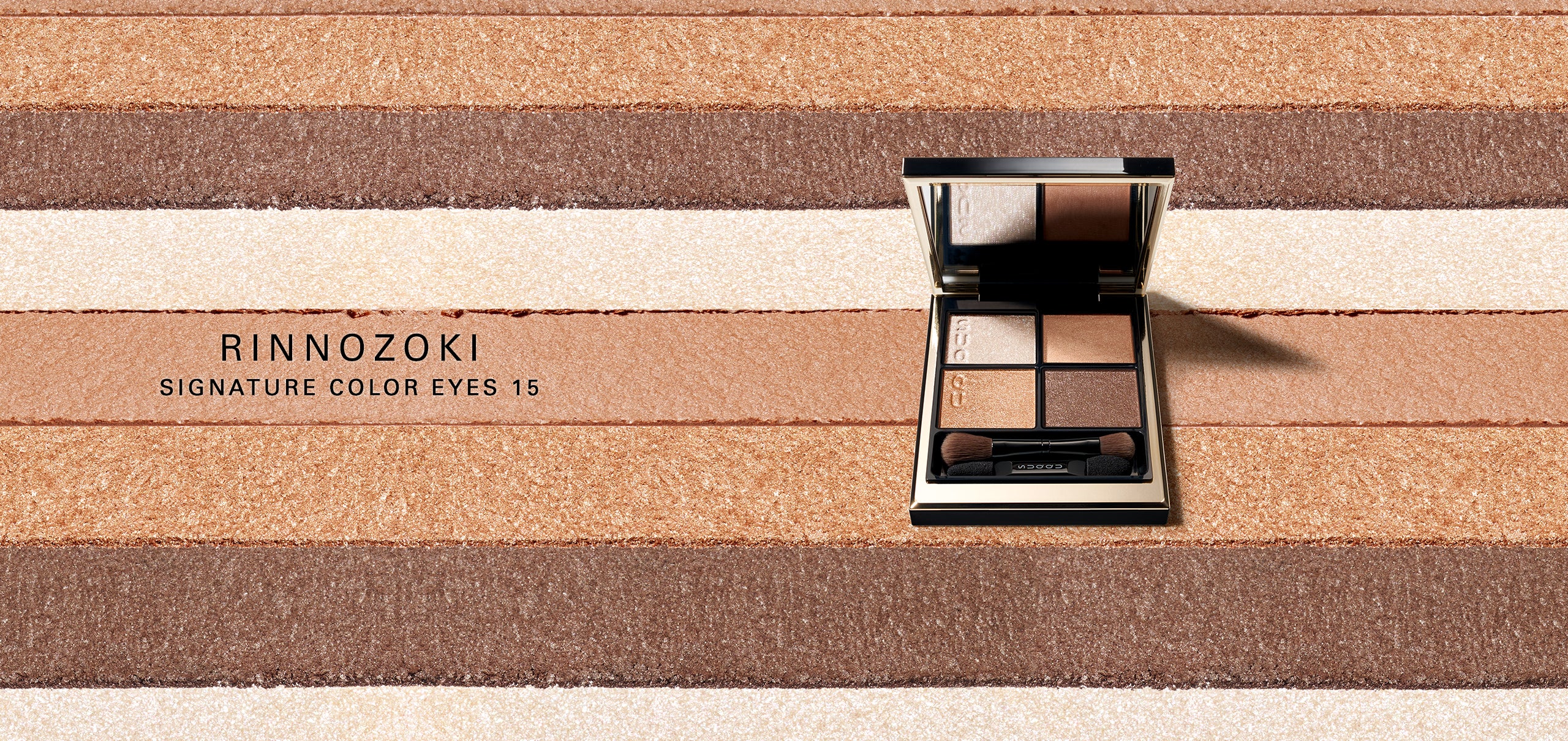 Rinnozoki Signature Color Eyes 15 eyeshadow palette with texture background.