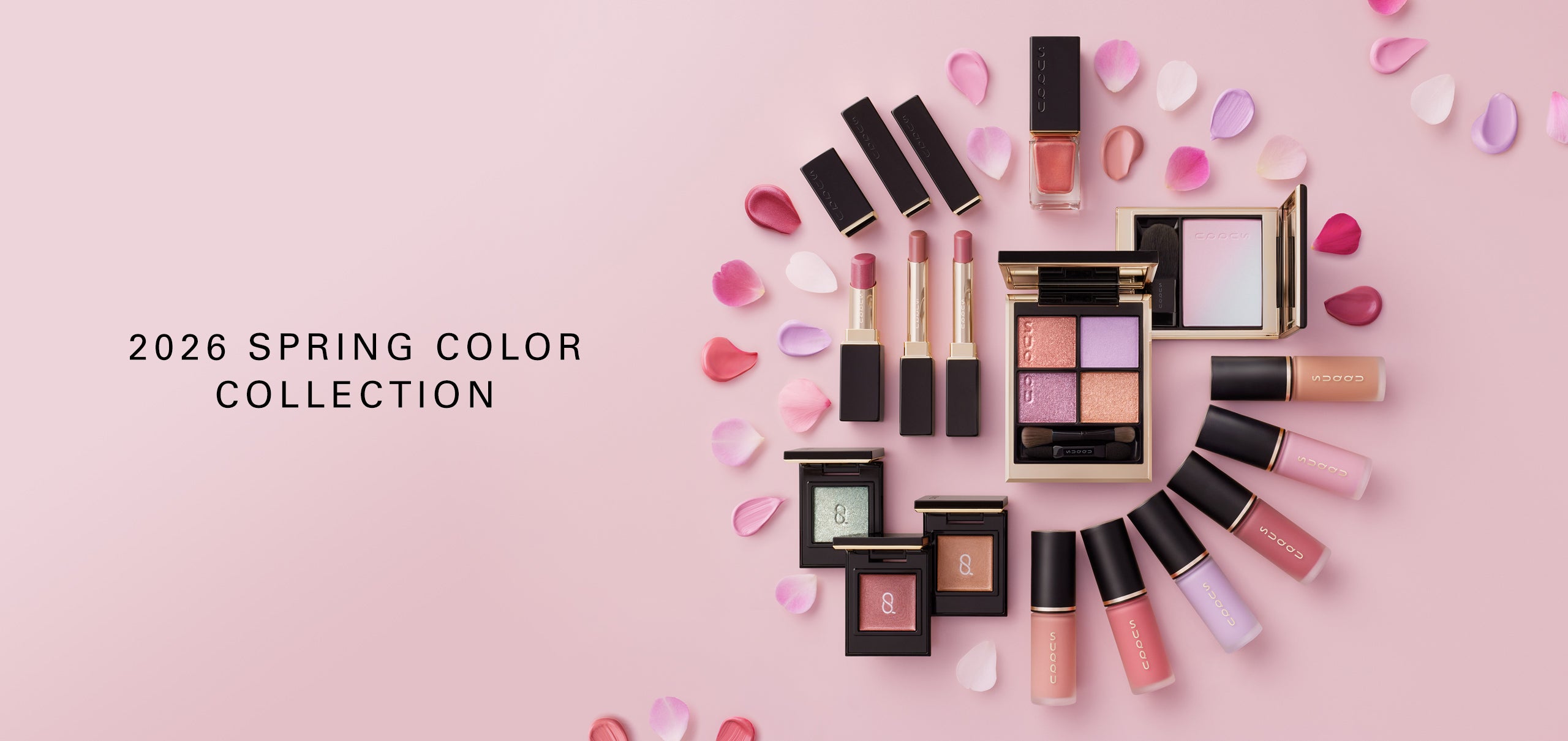 SUQQU Spring Collection 2026 group of colourful luxury makeup products lying on a table arranged in a circle with flower petals.