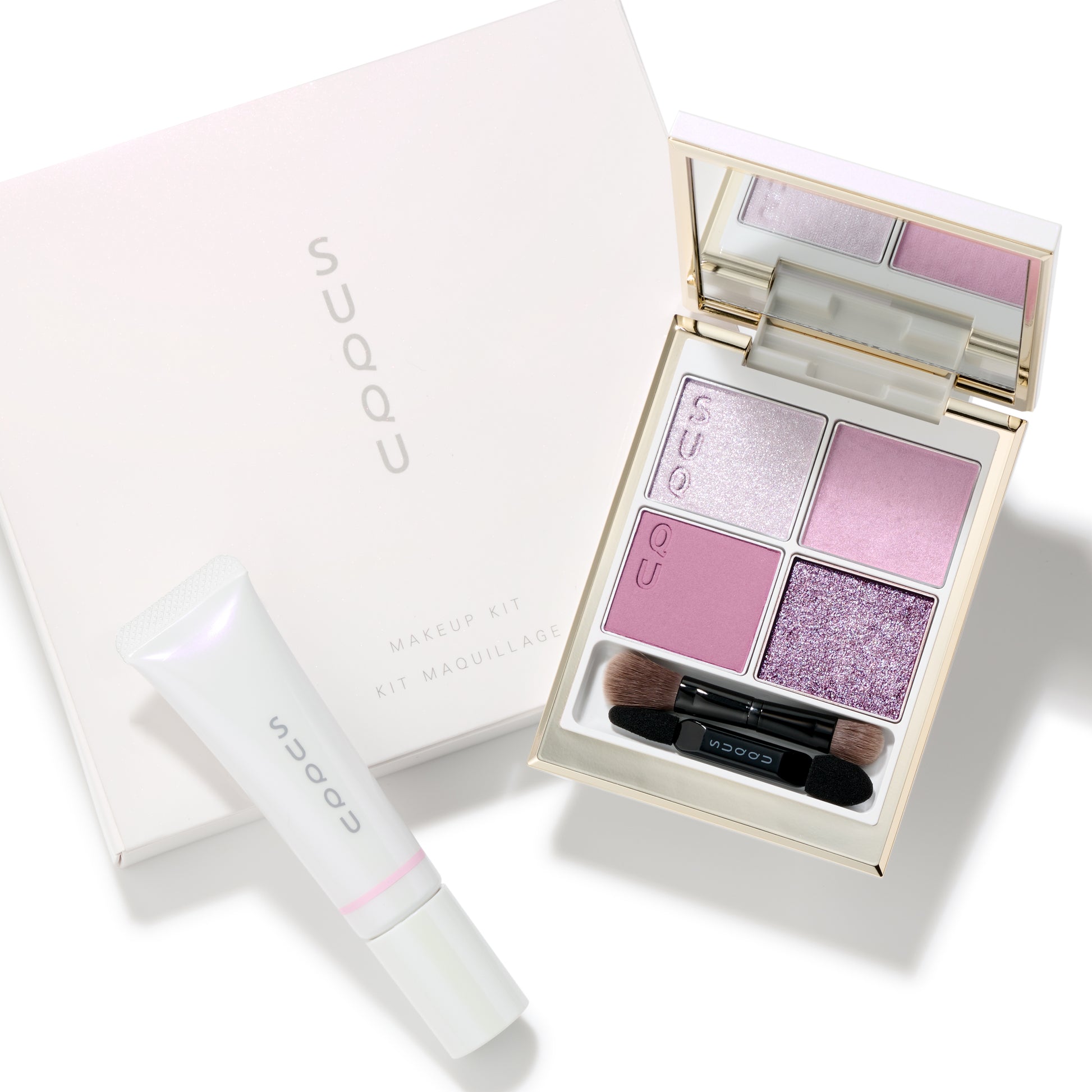 SUQQU 2025 Holiday Collection makeup kit Shunka showing pink toned quad eyeshadow palette and soft pink liquid blush tube with box.