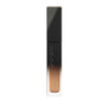 SUQQU Liquid Luster Eyes 02 shimmer orange gold eyeshadow product on plain background.