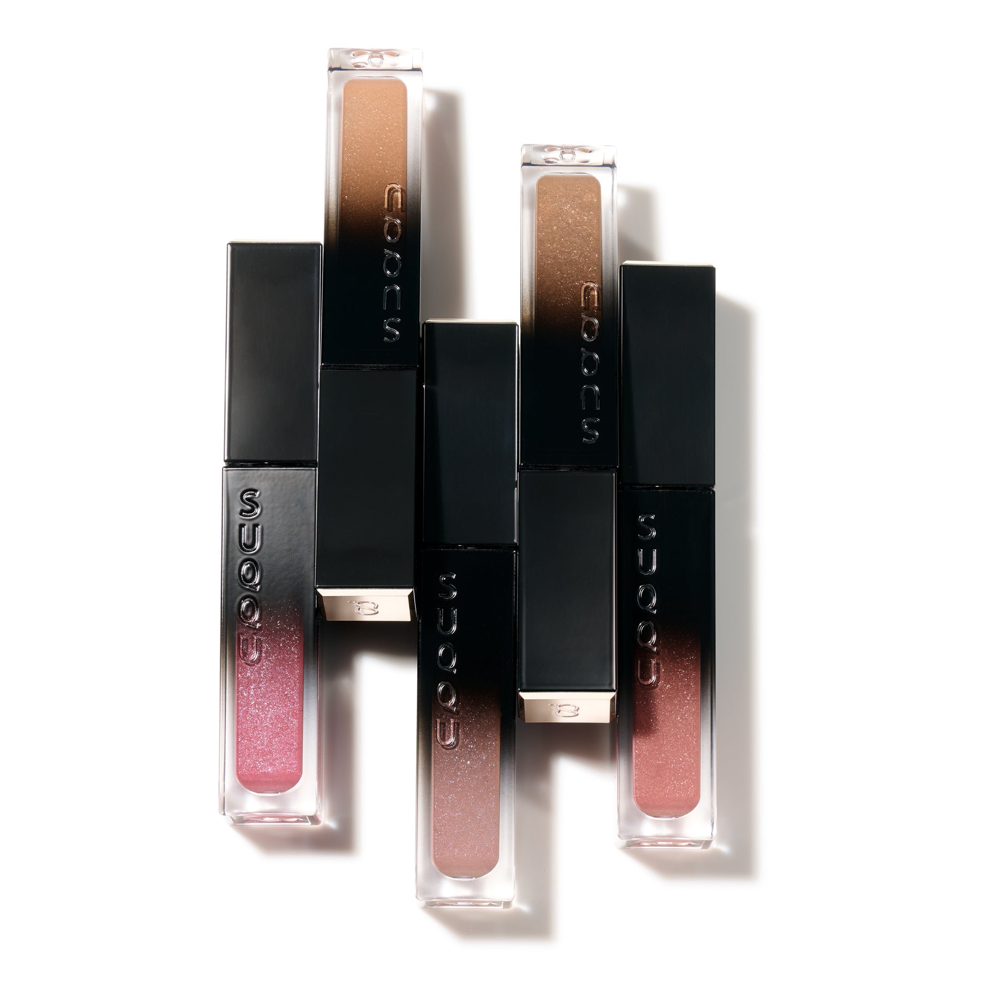 Five SUQQU Liquid Luster Eyes eyeshadow colour products on plain background