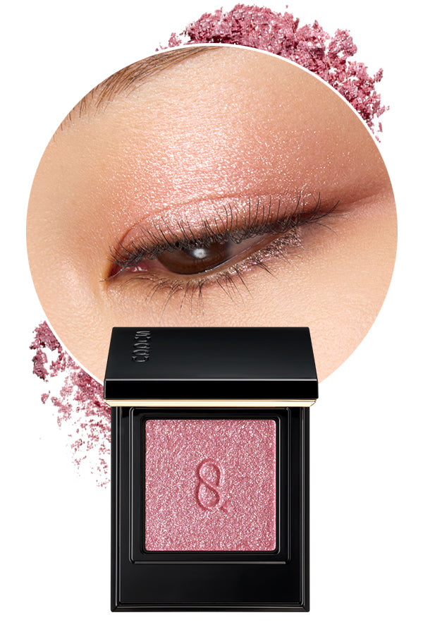Mono Look Eyes L-05 the best single colour eyeshadow range from SUQQU. A beautiful eyeshadow palette in sparkling pink glitter colour is shown with model eye wear closeup and swatch colour, displaying the creamy seamless finish and luxury texture.