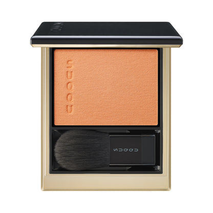 SUQQU Melting Powder Blush 104 smoky orange make up product palette open on plain background.