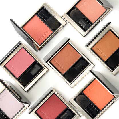 Multiple SUQQU Melting Powder Blush make up products grouped