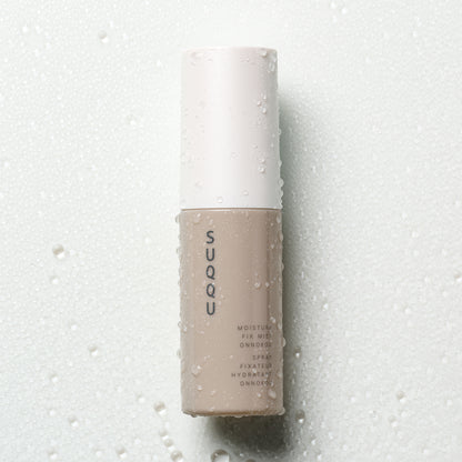 SUQQU Makeup Fix Mist Onnokou Japanese scented moisturising make up fix spray on water droplet background.