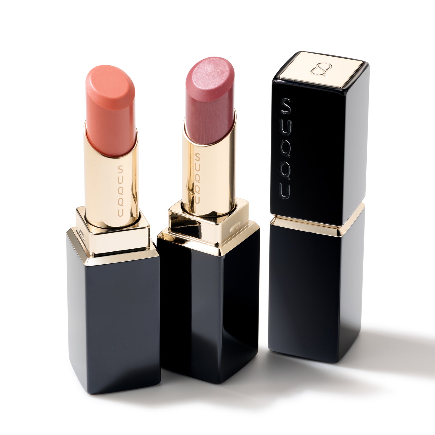 SUQQU Moisture Glaze Lipstick 107 and 108 on plain background with closed product case