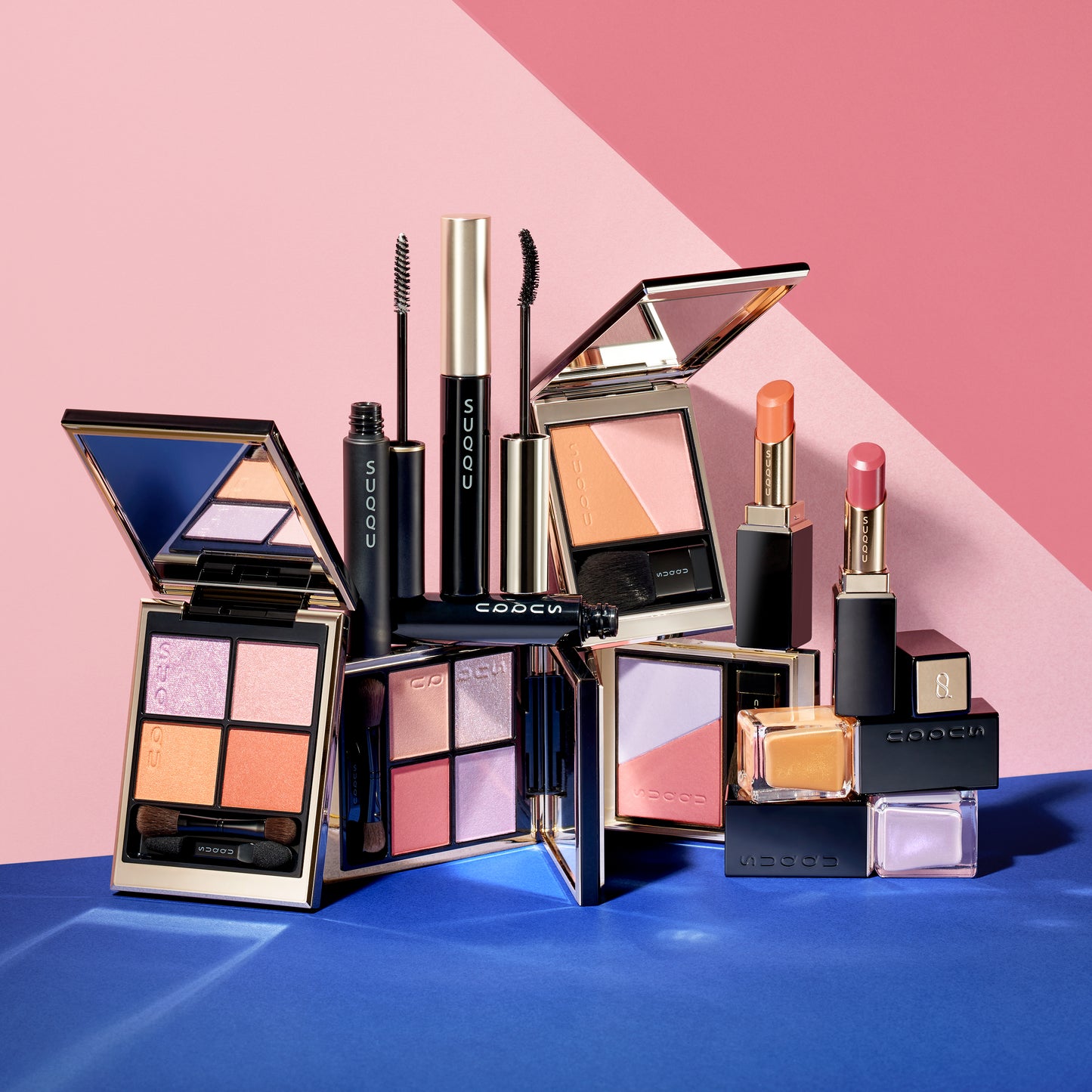 SUQQU 2025 Summer collection of colourful makeup products grouped on contrasting colours background.