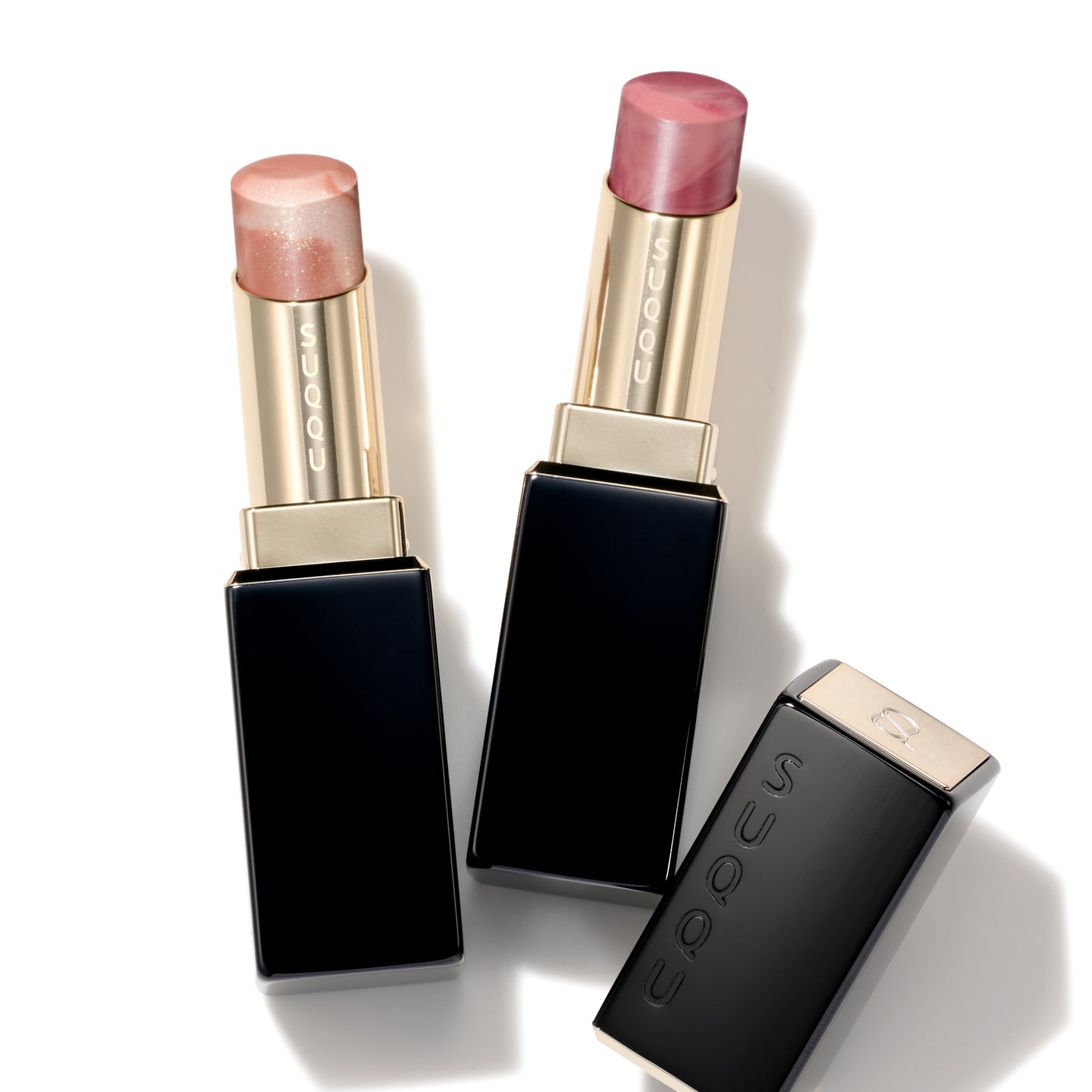 SUQQU Moisture Glaze Lipstick 112 and 113 refill with eco-friendly case shown with cap off.