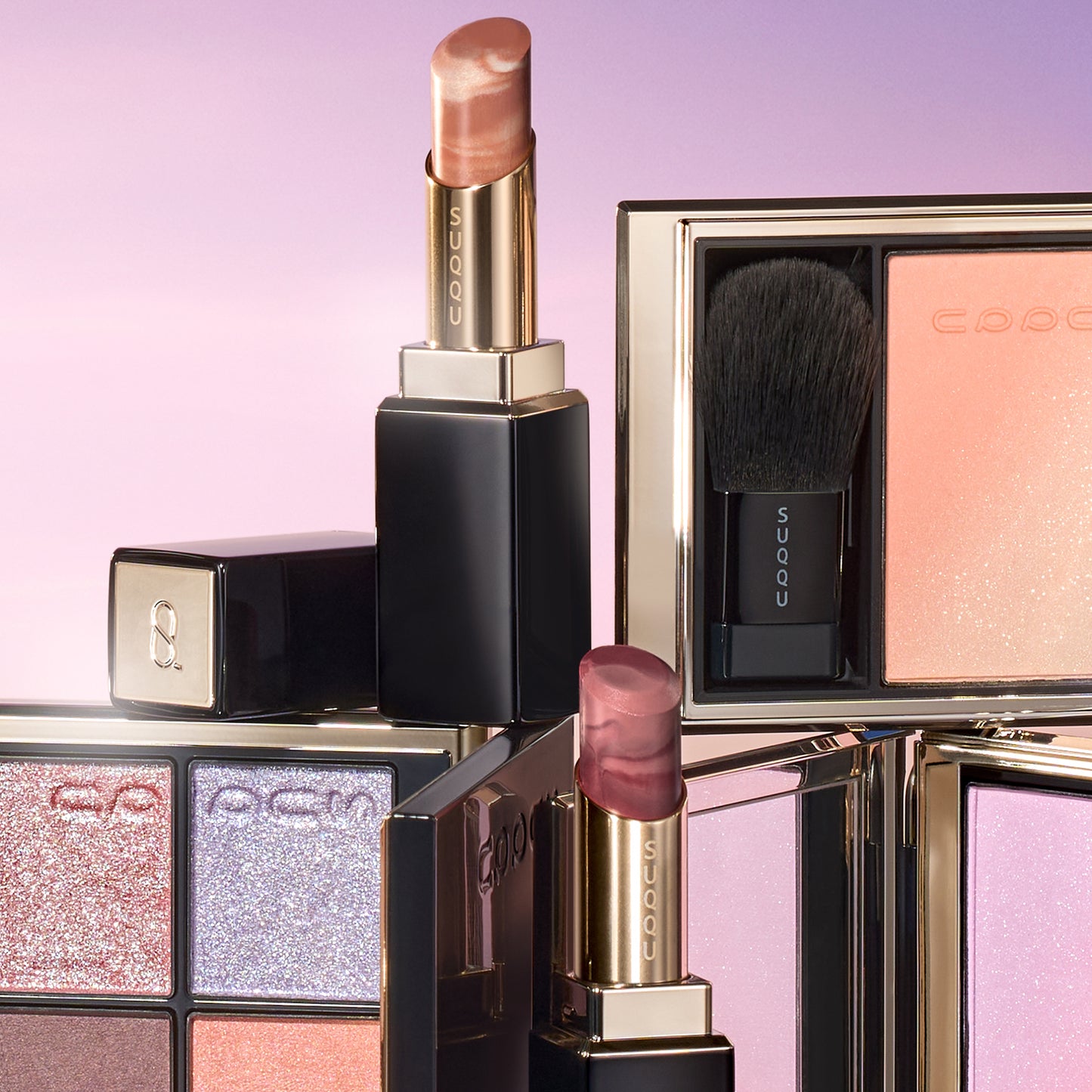 SUQQU 2026 Summer Collection, multiple beautiful colourful luxury makeup products on a gradient sky background. Two eyeshadows with gold and pink coral tones, two blushers with orange gold and lilac pink and two lipsticks in orange red and grape red.