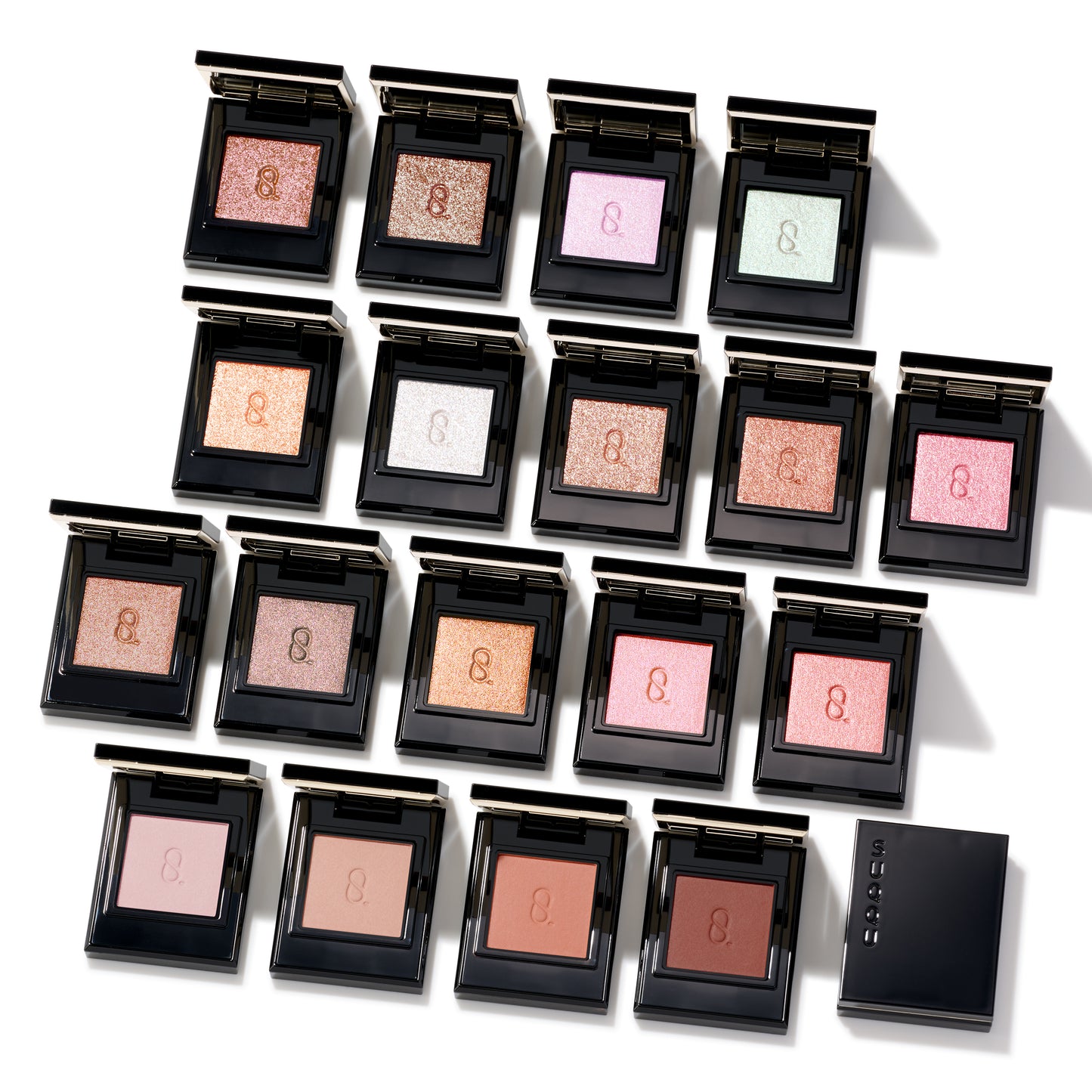 SUQQU Mono Look Eyes range of luxurious, best quality creamy powder eyeshadows from Japan. Group of 18 single colour palettes with lid open.