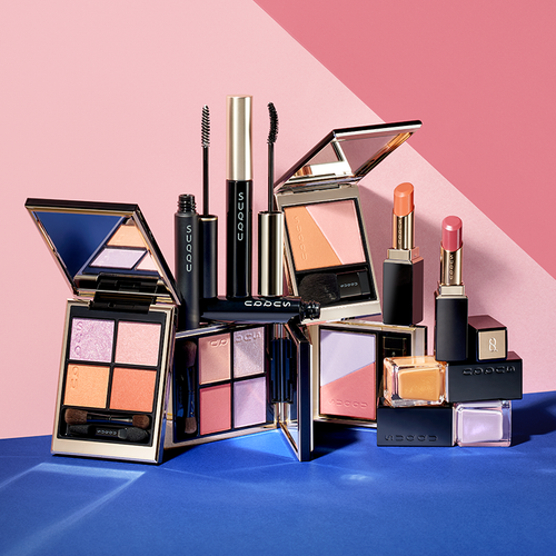 Summer Contrast - SUQQU 2025 Summer collection of colourful makeup products grouped on contrasting colours background.
