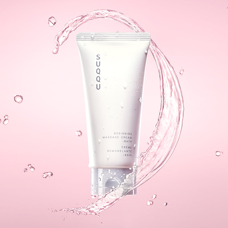 SUQQU Designing Massage Cream - Bath skincare mask and massage product tube with water splash.