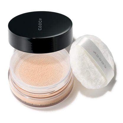 SUQQU Oil Rich Glow Loose Powder e face powder pot on white background with puff.