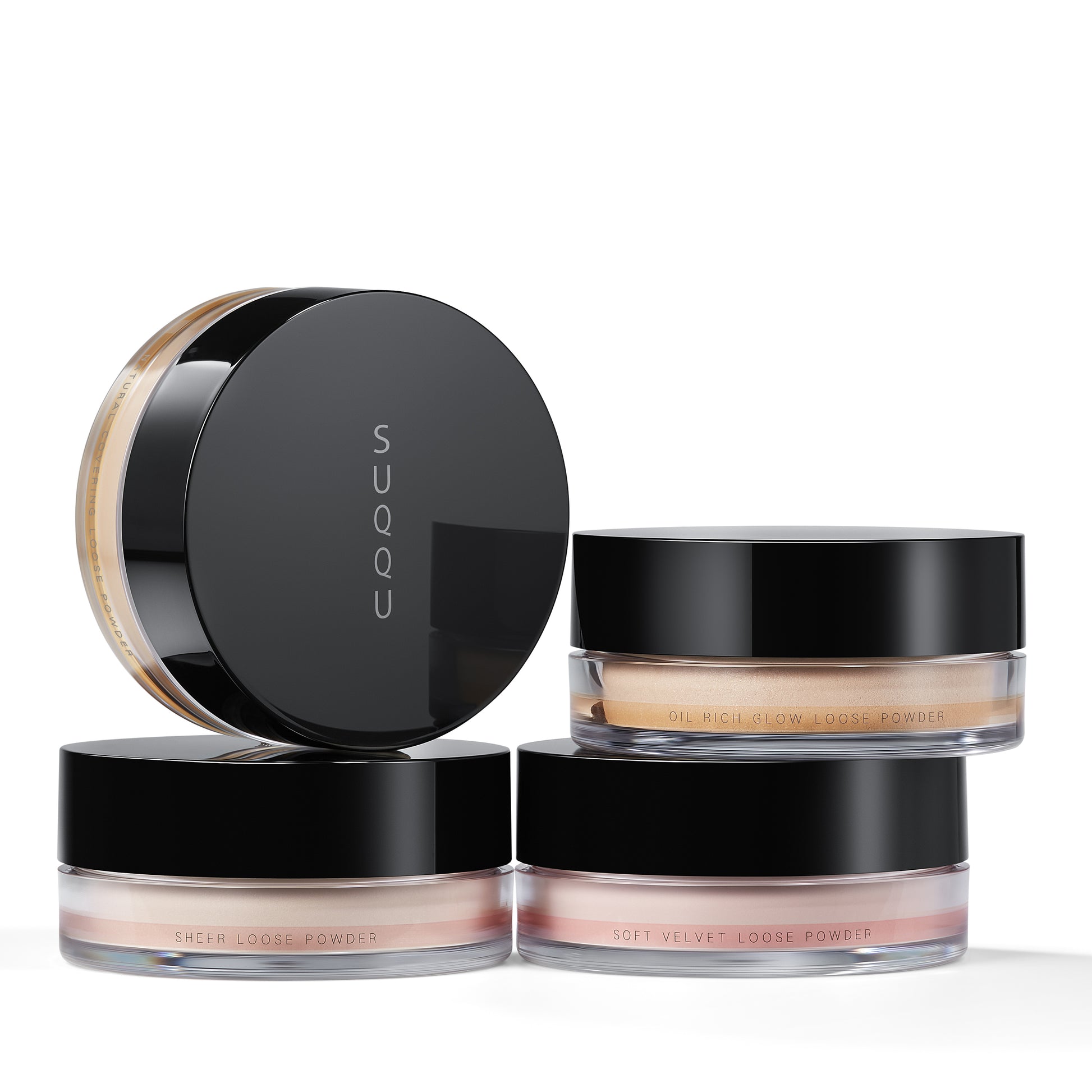 Four SUQQU face powder make up product pots stacked.
