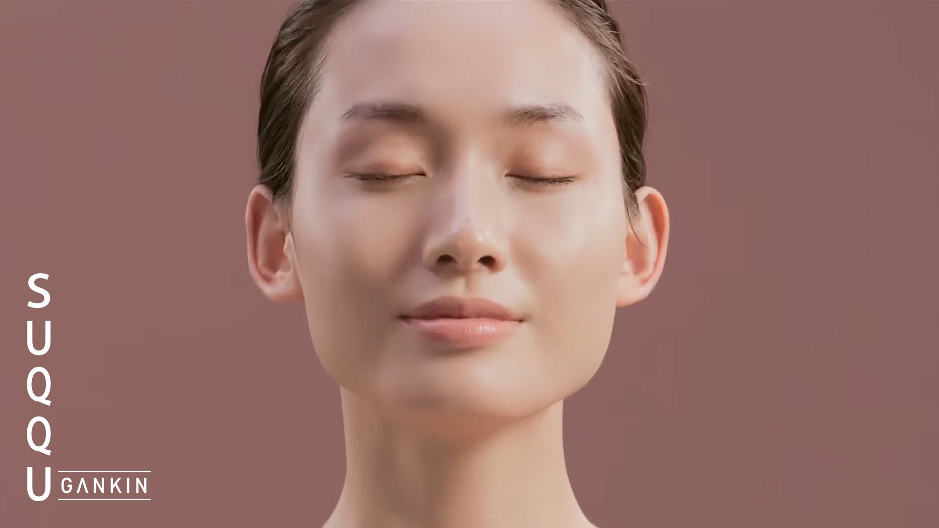 Load video: GANKIN self-facial massage video tutorial. Female performer shows the movements of each of the seven steps of the facial routine using her hands on her face, neck and collarbone.