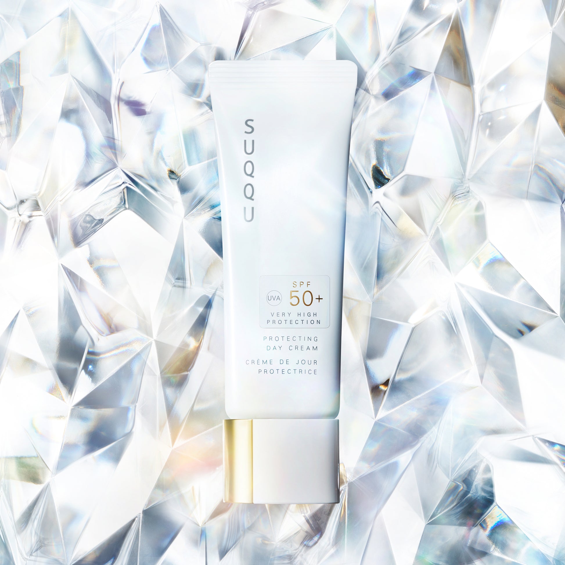 SUQQU Protecting Day Cream 50g SPF50 product tube of the best Japanese sun cream with crystal background.