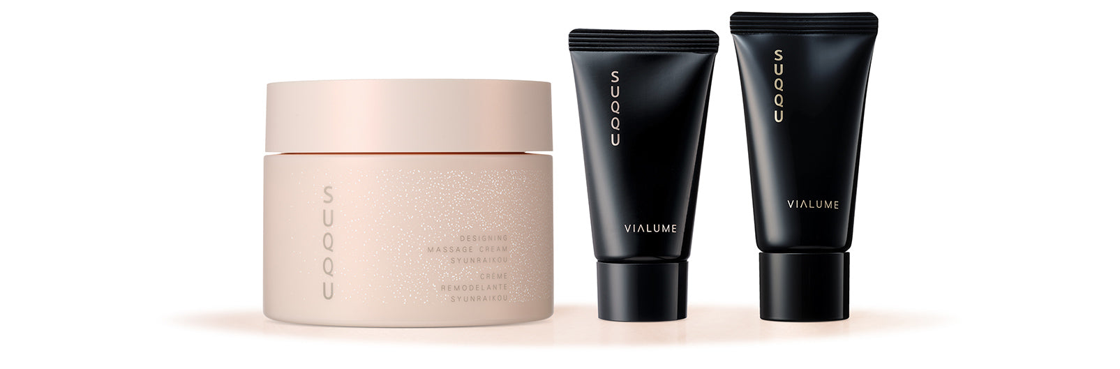 SUQQU Designing Massage Cream Syunraikou skincare tub and two Vialume skincare products