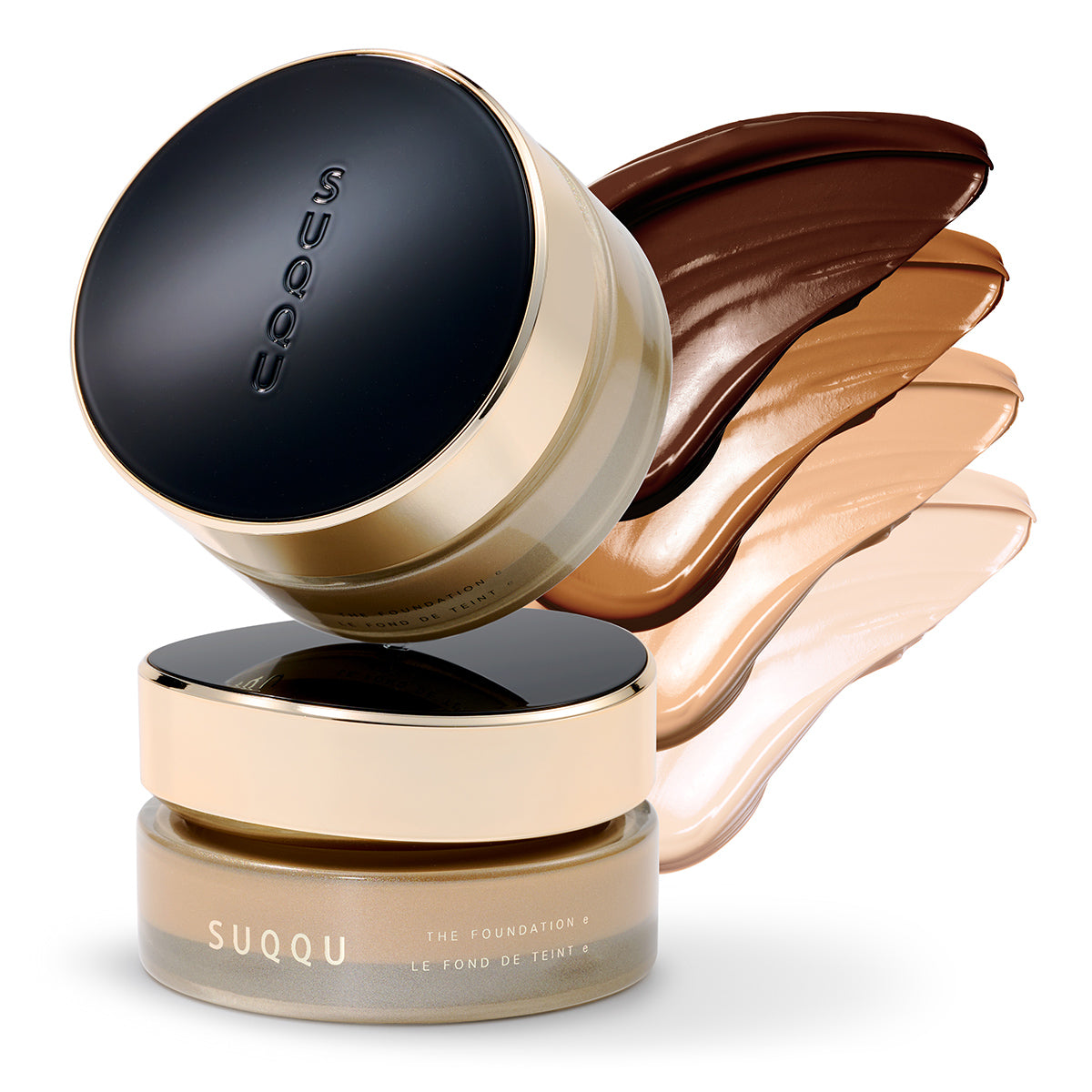 Two stacked SUQQU The Foundation e jars with black and gold lid. To the side are four cream texture swatches.