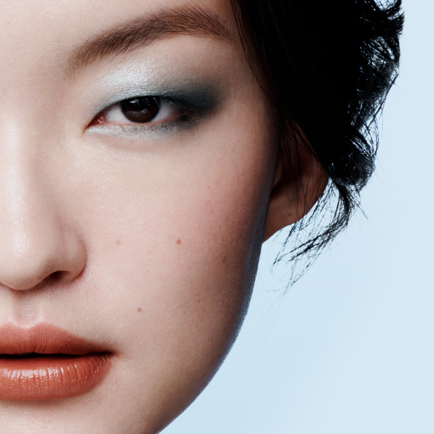 Model close up of eye, cheek and lip make up