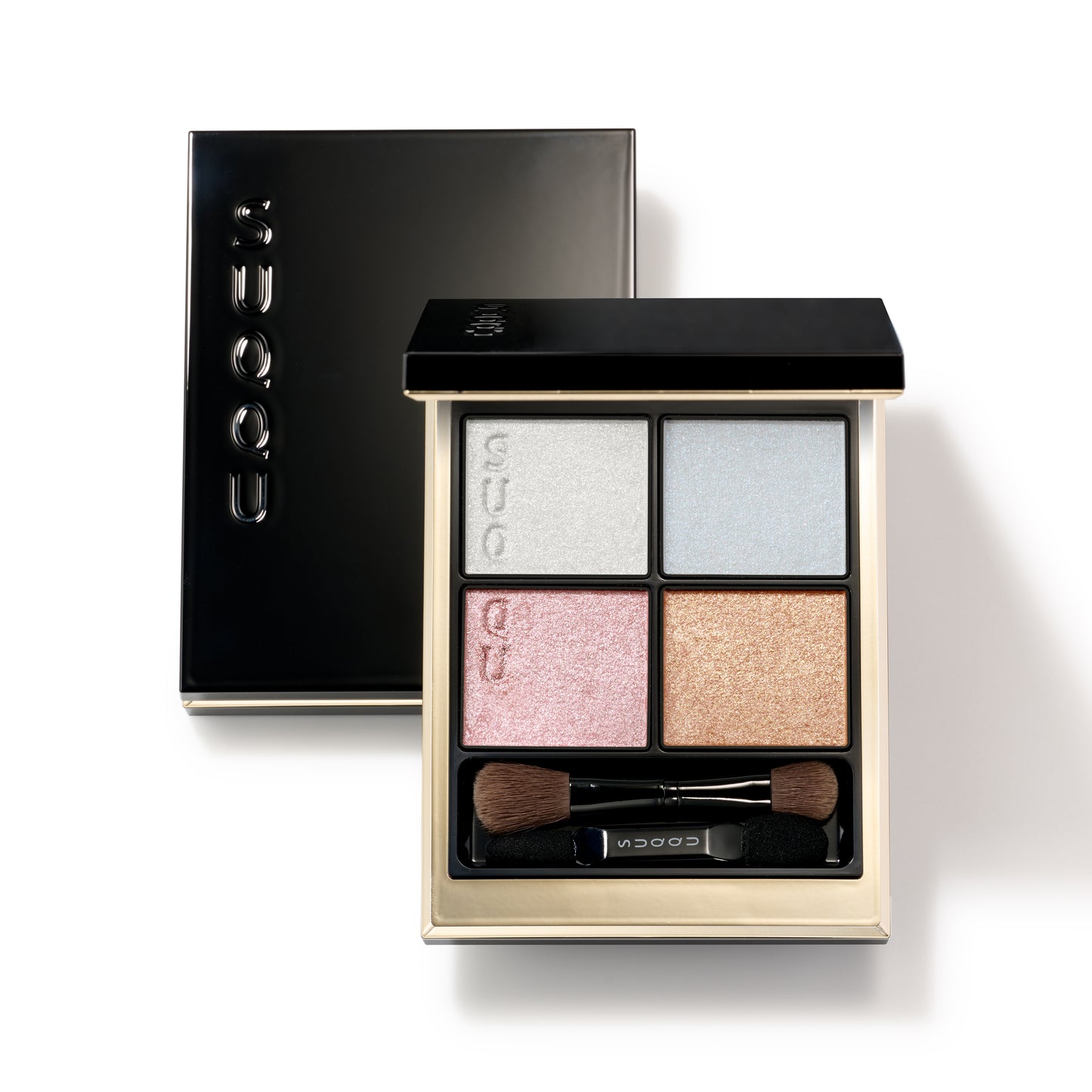 SUQQU Signature Color Eyes 156 glittering quad luxury eyeshadow palette on white background with closed palette lid. Soft pink, blue and gold shades with fine shimmering pearl white highlighter.