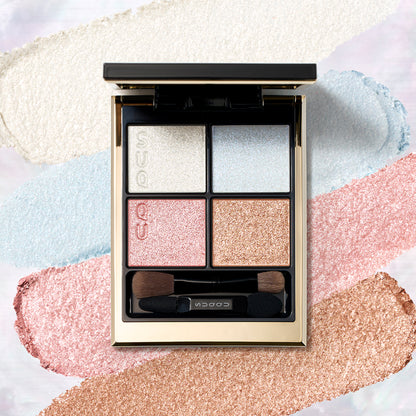 SUQQU Signature Color Eyes 156 gorgeous quad eyeshadow palette on creamy texture colour swatch background. Pale pink, blue and gold shades with shimmering pearl white highlighter.