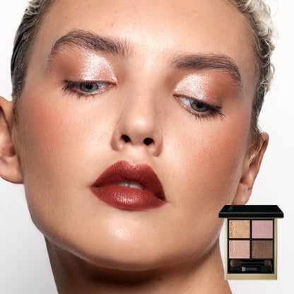 Close-up of a model with shimmering Signature Color Eyes 157 dusty pink, vintage rose & gold eyeshadow and deep reddish-brown lipstick, with a small makeup palette shown in the lower right corner against a clean white background.