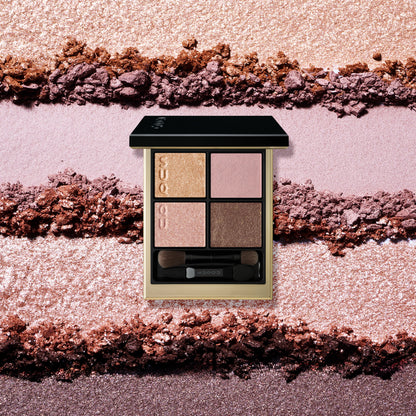 SUQQU Signature Color Eyes 157 luxury Japanese cosmetic quad eyeshadow compact on colourful textured background. Coral pink and pale beige pink with gold and brown. Fine textured pearl shimmers and creamy skincare ingredients.