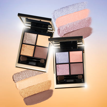 SUQQU 2026 Summer Collection, multiple beautiful colourful luxury makeup products on a gradient sky background. Two eyeshadows with gold and pink coral tones with colour texture swatches.