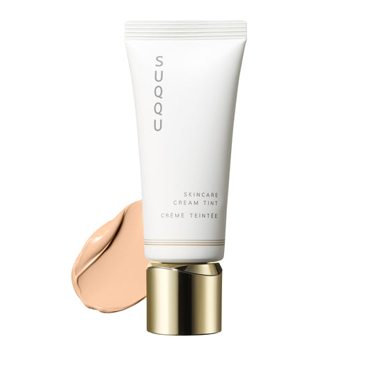 SUQQU Skincare Cream Tint 10, foundation tube with colour swatch texture.