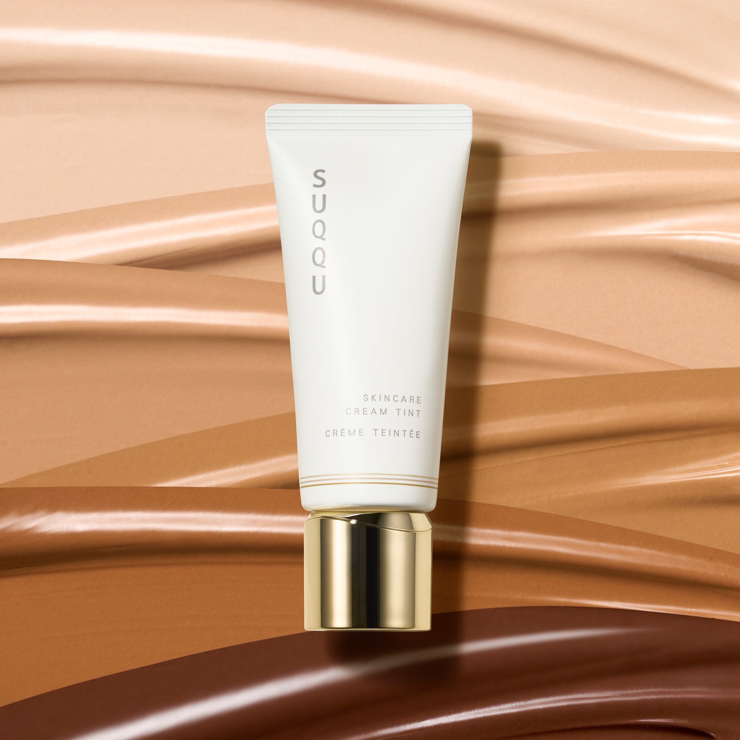 SUQQU Skincare Cream Tint skincare based light liquid foundation product tube on colourful liquid texture background.