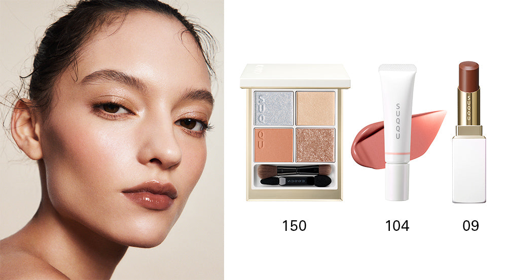 SUQQU 2025 Holiday Collection makeup kit Hikarikazari showing blue and gold toned quad eyeshadow palette 150 and soft red liquid blush tube 104 with Moisture Glaze Lipstick 09 and model portrait wearing the makeup.