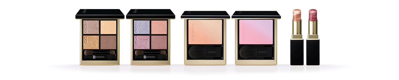 SUQQU 2026 Summer Collection colourful luxurious makeup products standing in a line. Including two beautiful quad eyeshadow palettes, two cheek blusher / highlighters and two lispticks. SUQQU - The highest quality skincare and cosmetics from Japan.