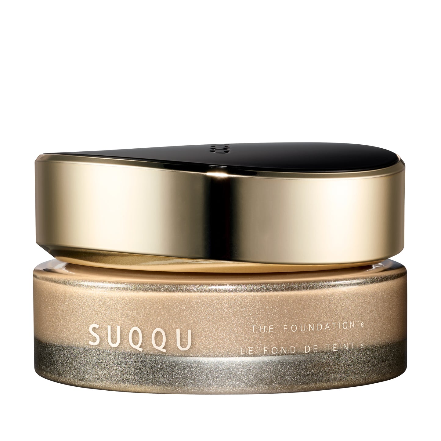 SUQQU The Foundation e 020 luxury cream base makeup jar on plain white background with gold and black lid and frosted glass base. Light beige cream foundation shade.