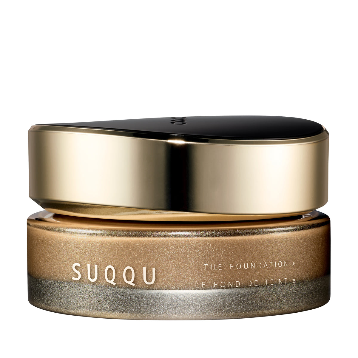 SUQQU The Foundation e 040 luxury cream base makeup jar on plain white background with gold and black lid and frosted glass base. Medium cafe brown cream foundation shade.