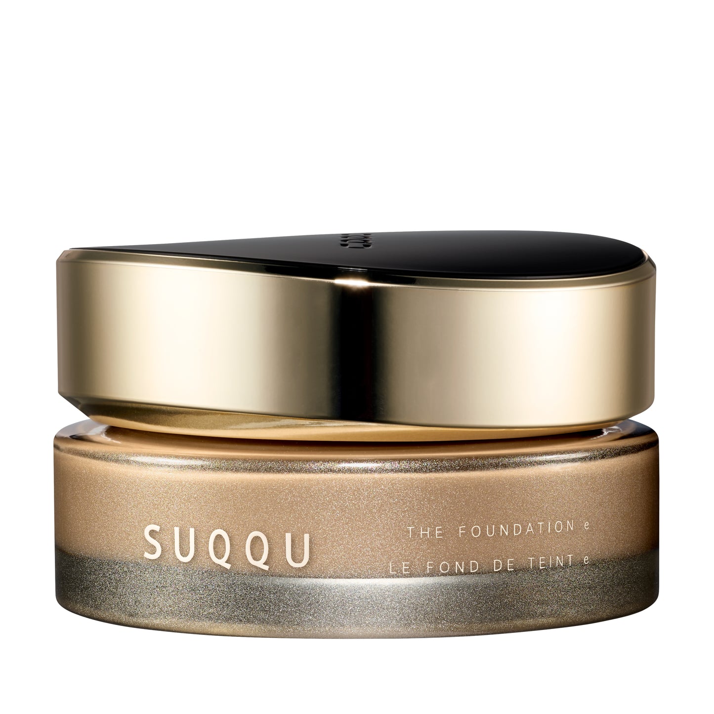 SUQQU The Foundation e 130 luxury cream base makeup jar on plain white background with gold and black lid and frosted glass base. Light brown beige cream foundation shade.