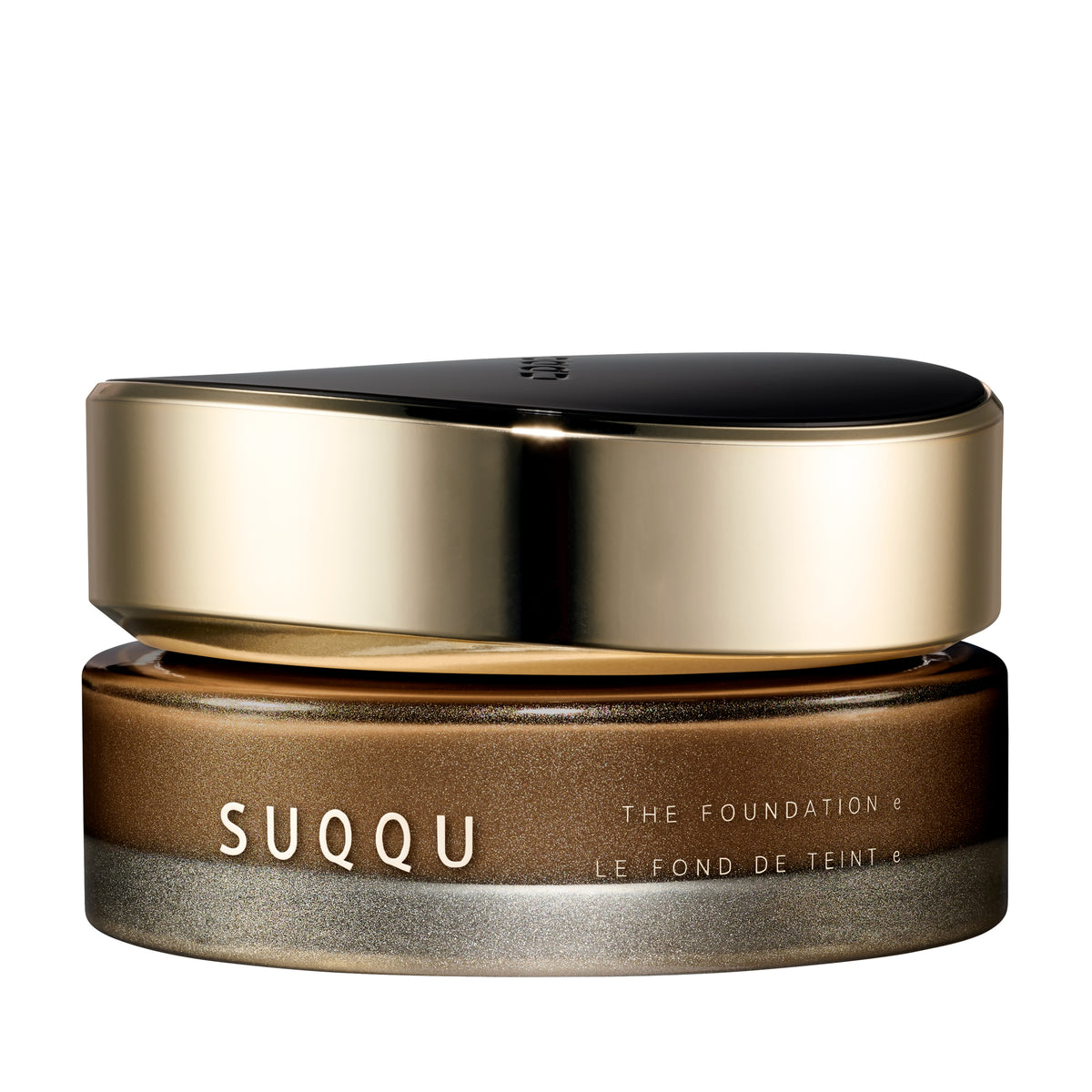 SUQQU The Foundation e 165 luxury cream base makeup jar on plain white background with gold and black lid and frosted glass base. Medium to dark brown cream foundation shade.