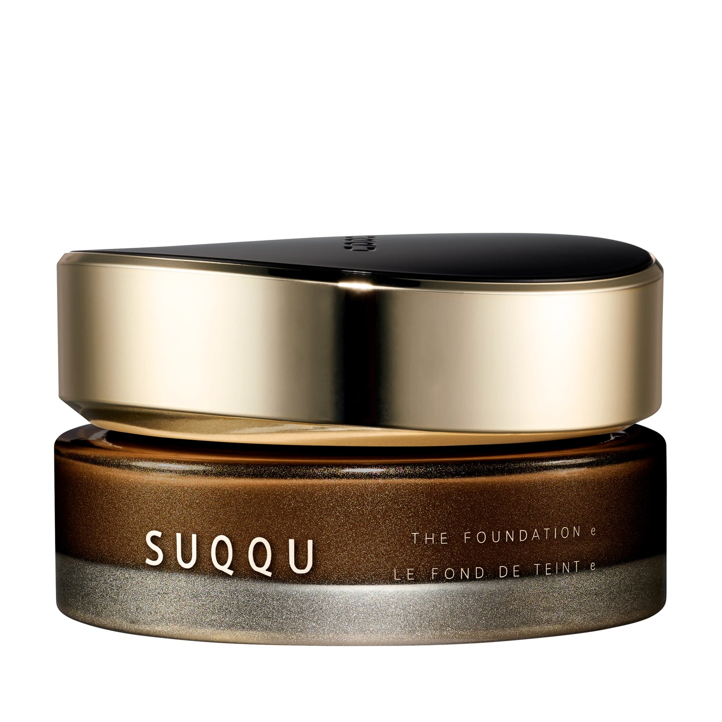 SUQQU The Foundation e 180 luxury cream base makeup jar on plain white background with gold and black lid and frosted glass base. Dark brown cream foundation shade.