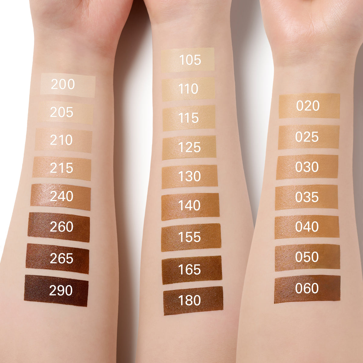 Three forearm swatches display numbered SUQQU 'The Foundation e' shade options ranging from very light beige to deep brown, with numbers such as 200, 290, 105, 180, and 060 printed over each swatch.