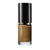 SUQQU The Liquid Foundation 060 luxury Japanese base make up bottle on plain background.