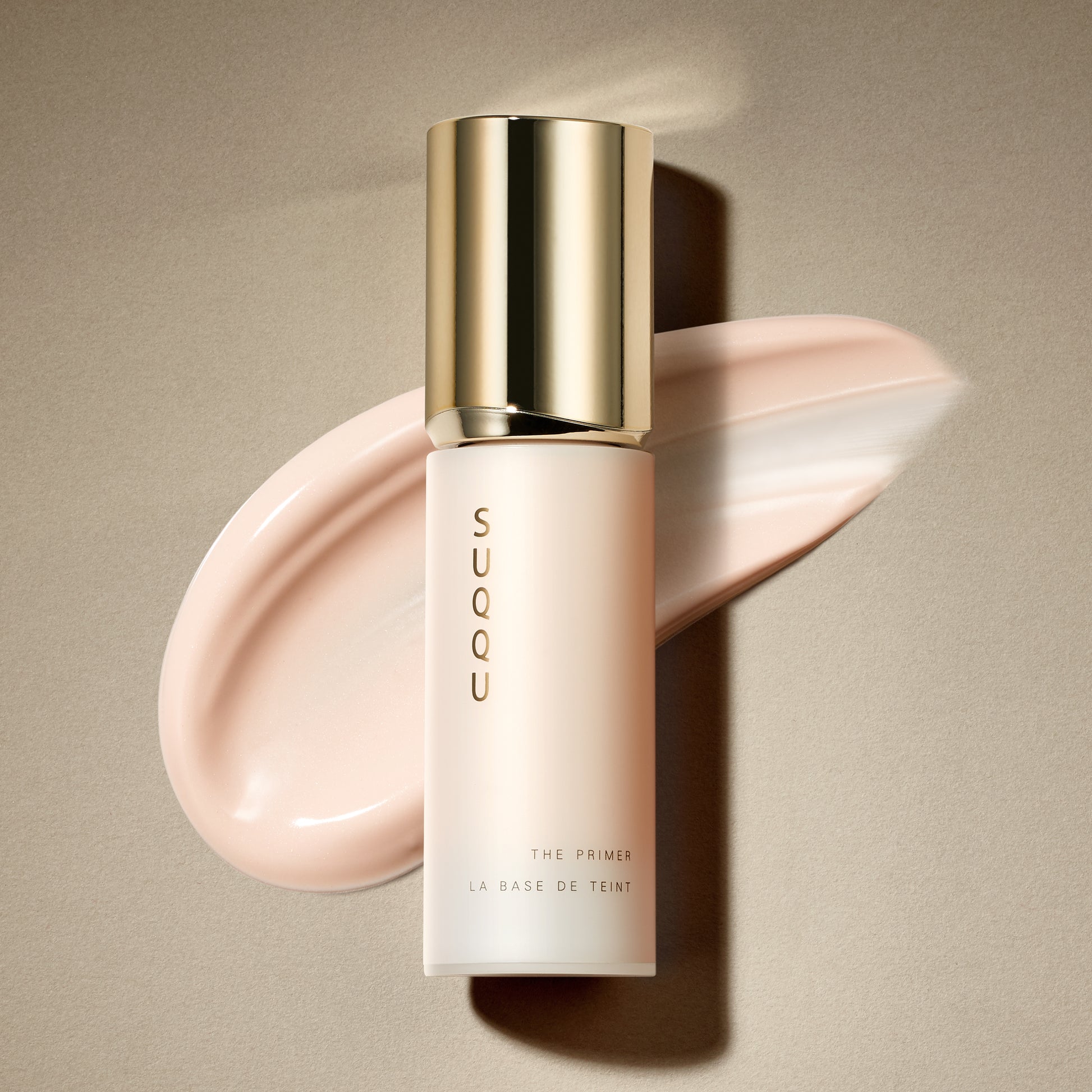 SUQQU The Primer luxury base make up product bottle on plain background with texture swatch.